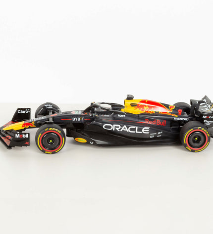 Two Red Bull F1 2023 remote-controlled toy cars, 1:10 scale, featuring detailed design and vibrant red and black colors.