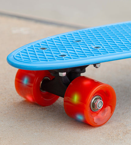 Set of four EVO skateboards with colorful decks, designed for kids' outdoor play and sports activities.