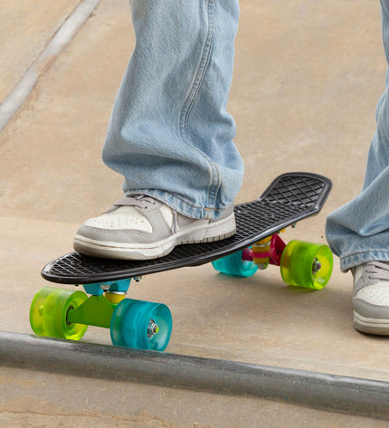 Set of four EVO skateboards with colorful decks, suitable for kids and outdoor play, in a vibrant, sporty design.