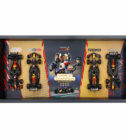 Set of four Red Bull Raceauto BURAGO toy cars in red, featuring detailed design and branding, perfect for collection or play.