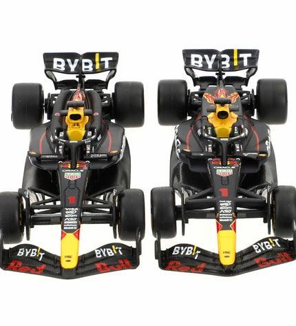 Set of four Red Bull Raceauto toy vehicles by BURAGO, featuring detailed miniature racing cars in red with racing branding.