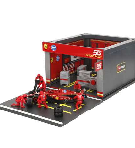 Four Ferrari toy trucks in vibrant red, detailed miniature vehicles from Ferrari for play or collection.