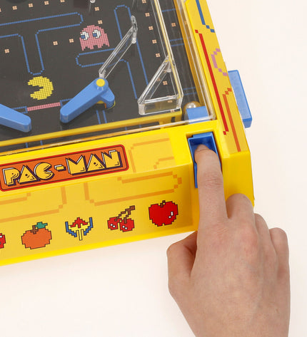 Two Pac-Man Dominoes from the Pac-Man toy and game collection, featuring classic arcade character designs.