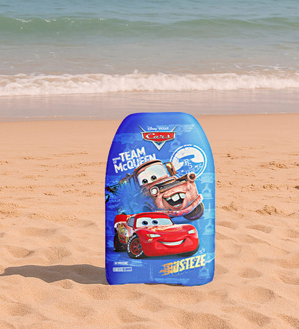 Cars BodyBoard 43.5 x 4 x 28.5 cm for watersport, showing a sleek blue bodyboard on a sandy beach.