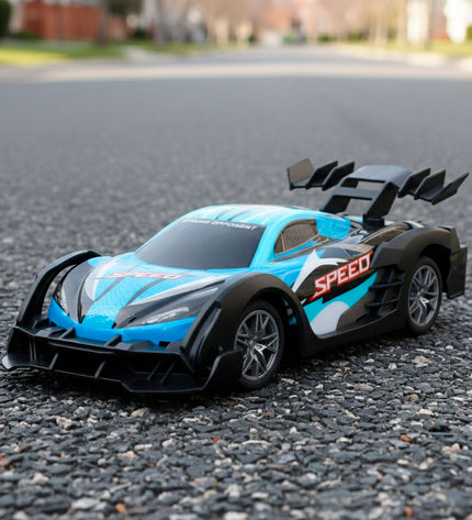 Four Speed & Go remote-controlled toy cars with adjustable motors, shown in a close-up shot on a white background.