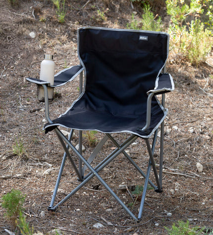 Set of four black Aktive folding camping chairs, lightweight and compact, ideal for outdoor activities and hiking.