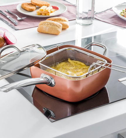 Copper 5 in 1 multifunctional ceramic cookware set by InnovaGoods with four interlocking kitchen pots and pans.