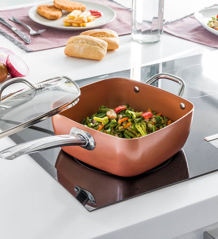 InnovaGoods Copper 5-in-1 ceramic cookware set with four kitchen utensils, showcasing the versatile kitchen tools and pans.