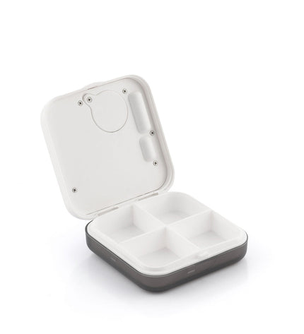InnovaGoods electronic intelligent pill organizer with digital display and compartments for home, kitchen, and bathroom use.