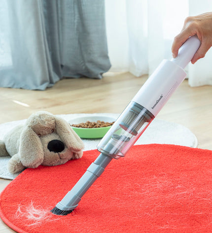 InnovaGoods rechargeable handheld vacuum cleaner with three accessories for home cleaning, floor and window maintenance.