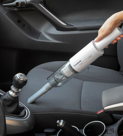 InnovaGoods rechargeable handheld vacuum cleaner with three accessories for cleaning surfaces and floors.
