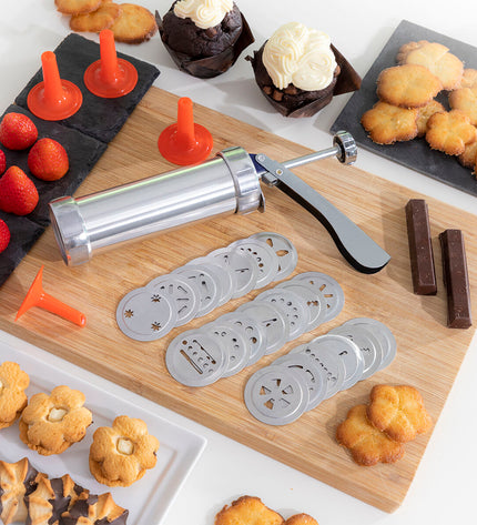 InnovaGoods 2-in-1 cookie press and decorating tool for baking, shown in use with cookies and icing in a kitchen setting.