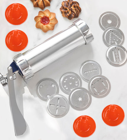 InnovaGoods 2-in-1 cookie press and decorating tool for baking, with stainless steel and plastic components, on a kitchen countertop.