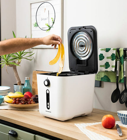 Electric compost machine for kitchen by Ewooster InnovaGoods, compact appliance with a sleek design for kitchen waste recycling.